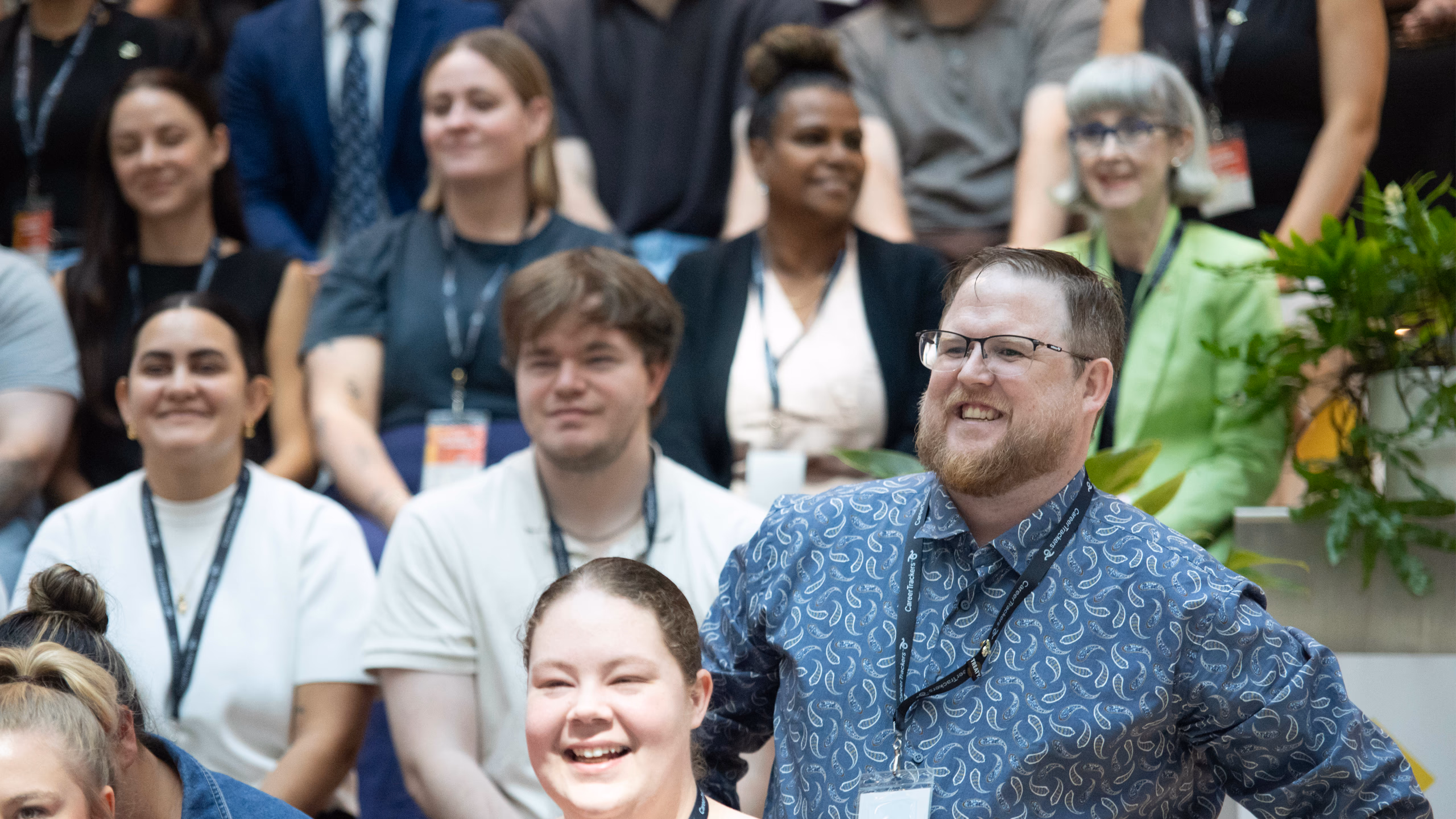 CareerTrackers alumni laughing together at a program event.