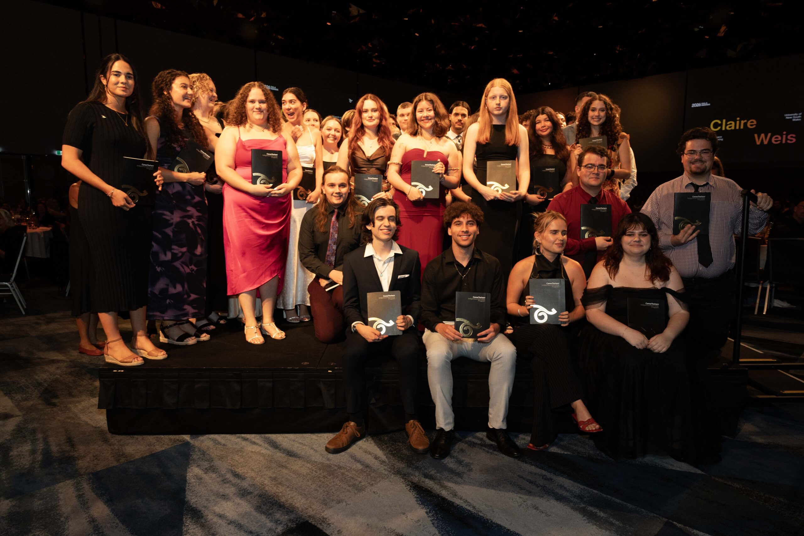 CareerTrackers interns and alumni posing together with their awards at the National Gala Awards.