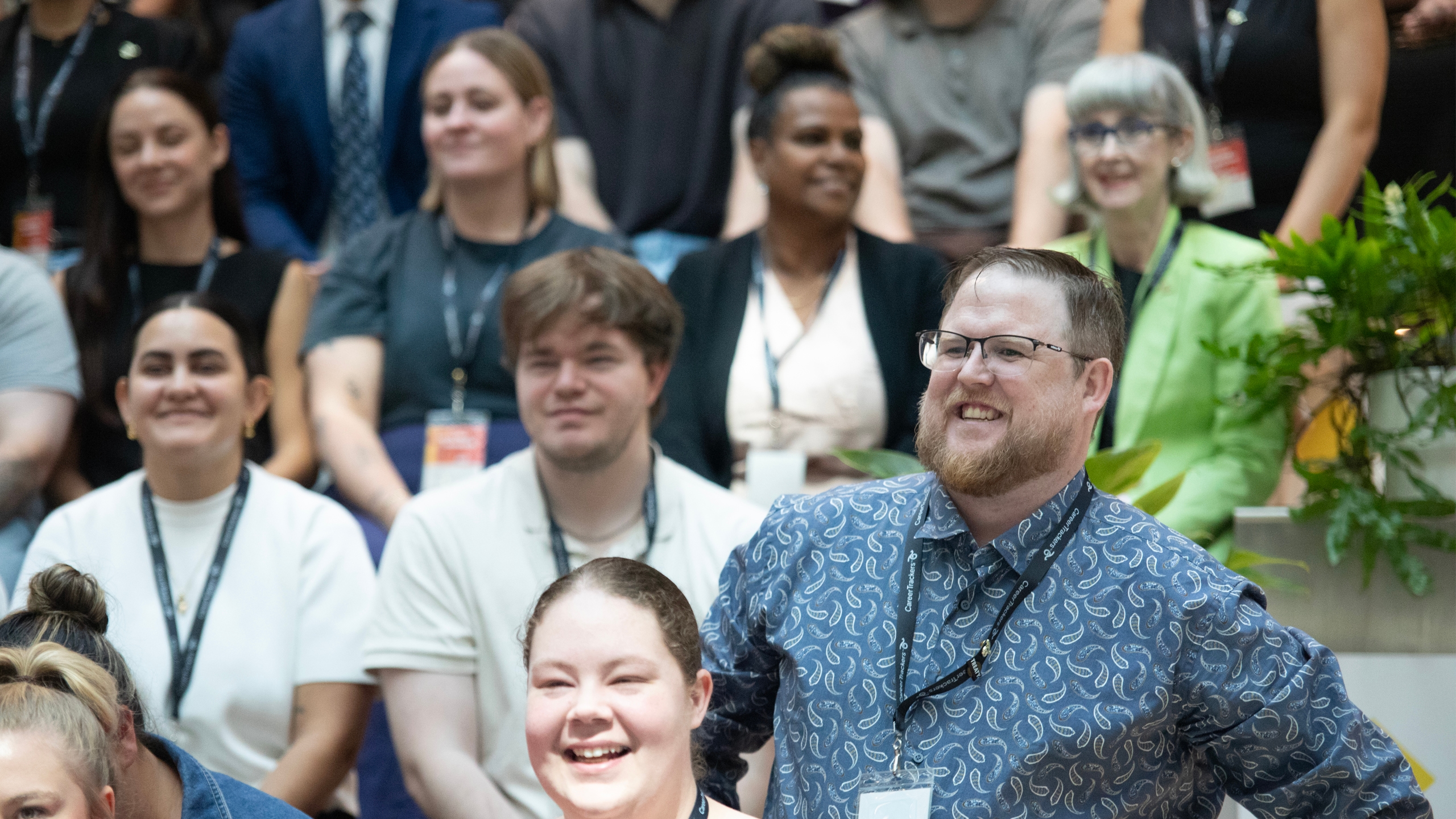 CareerTrackers alumni laughing together at a program event.