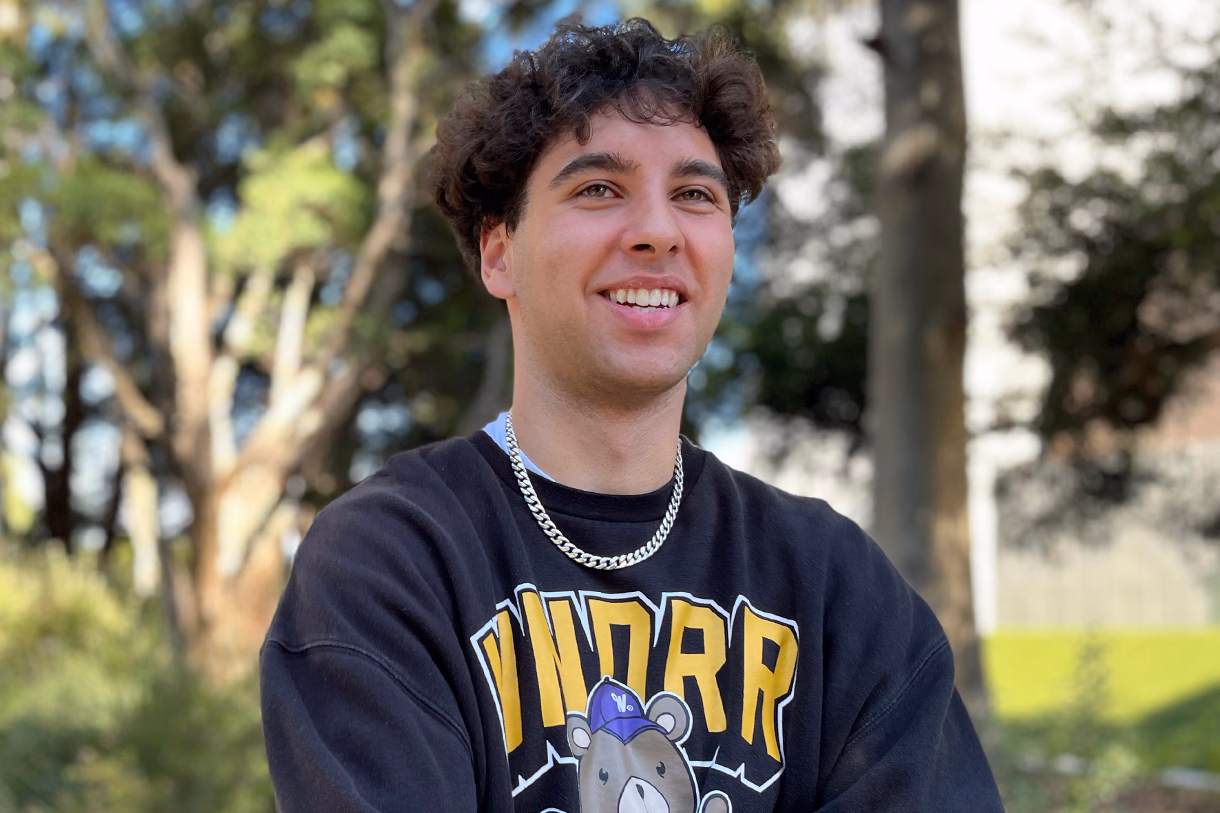 Coby Peterson smiling on the Monash University campus