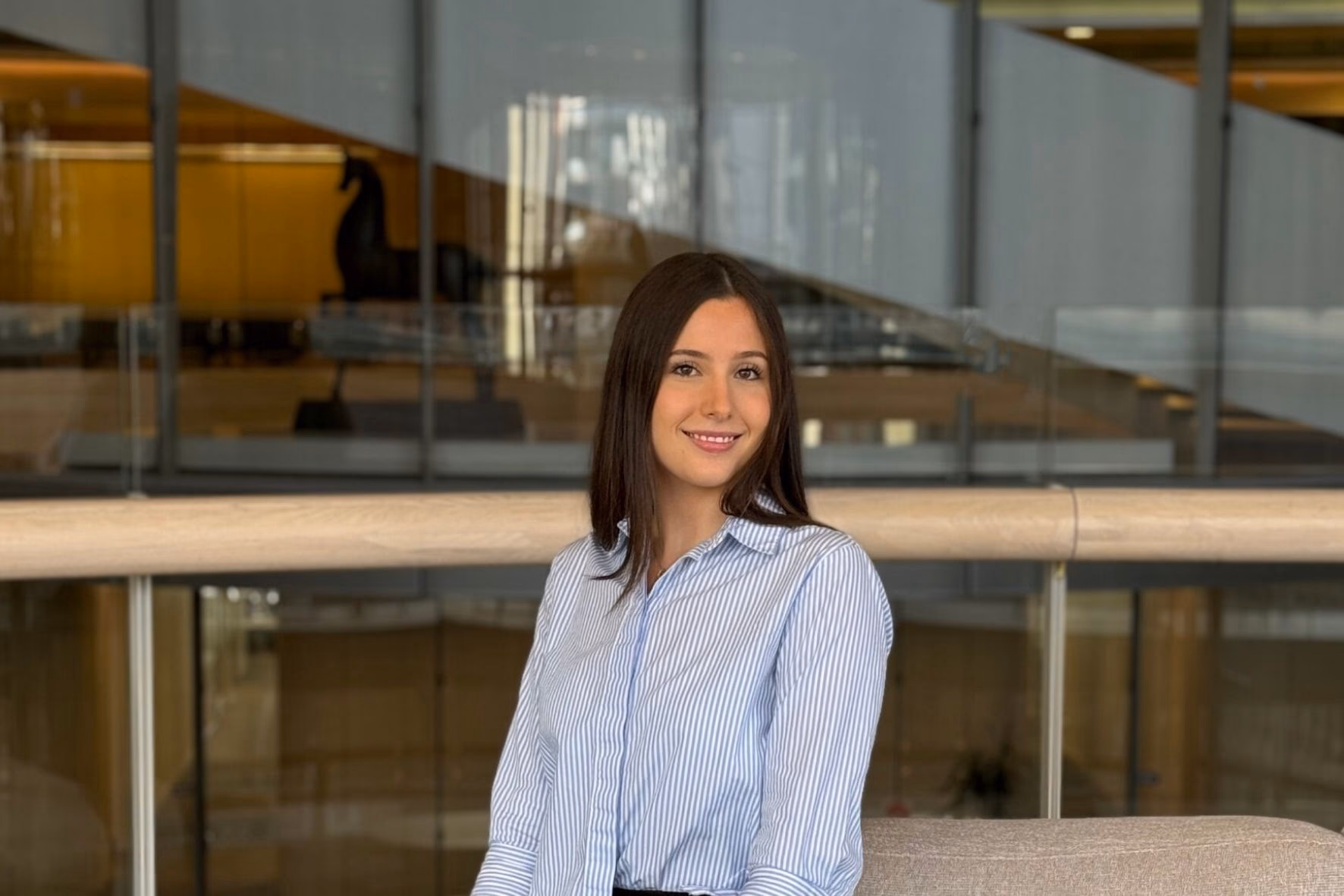 Samantha Colless seated in the Clayton Utz offices
